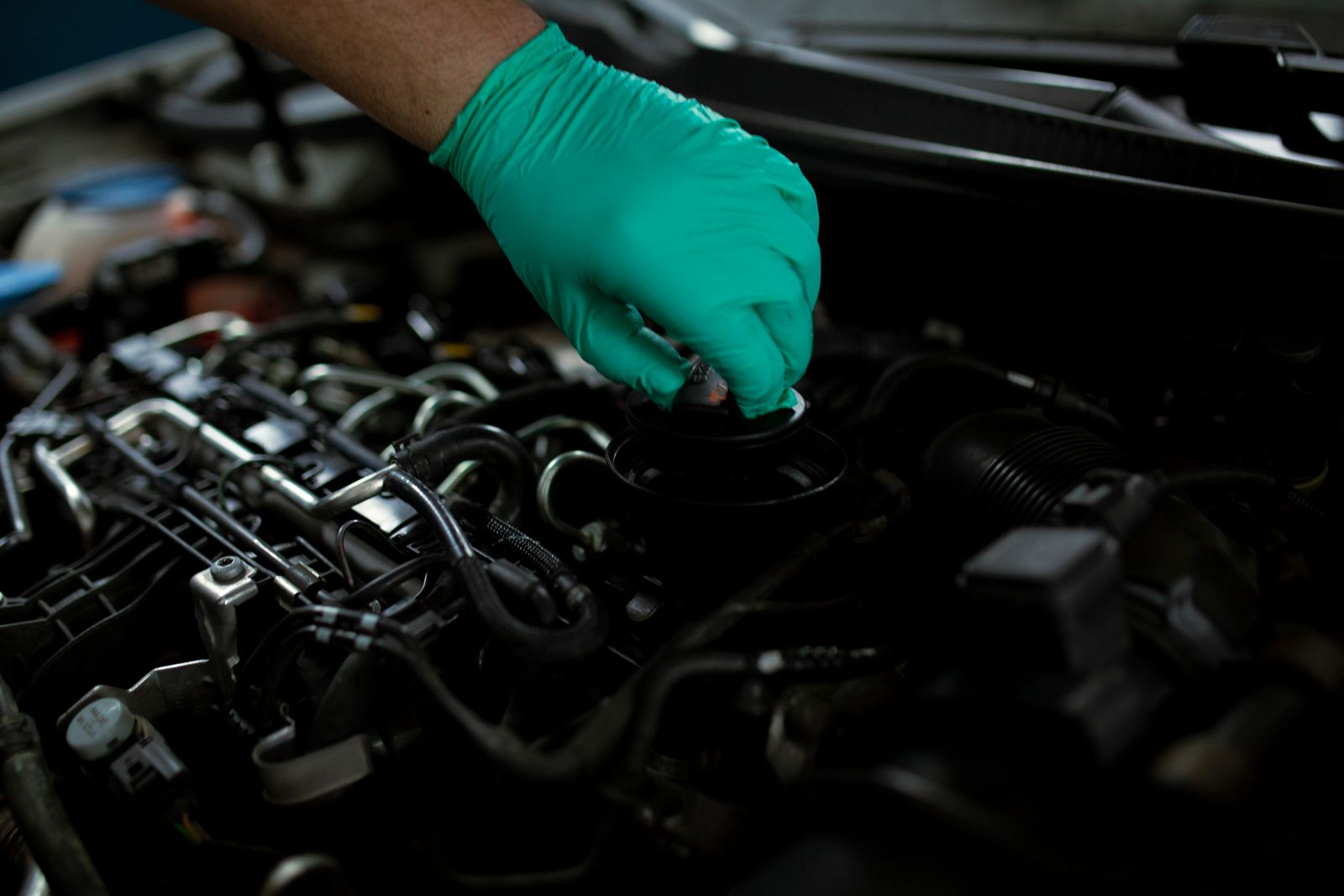 Technician performing routine maintenance on a vehicle